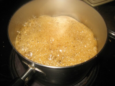 syrup in pot with many bubbles and getting frothier