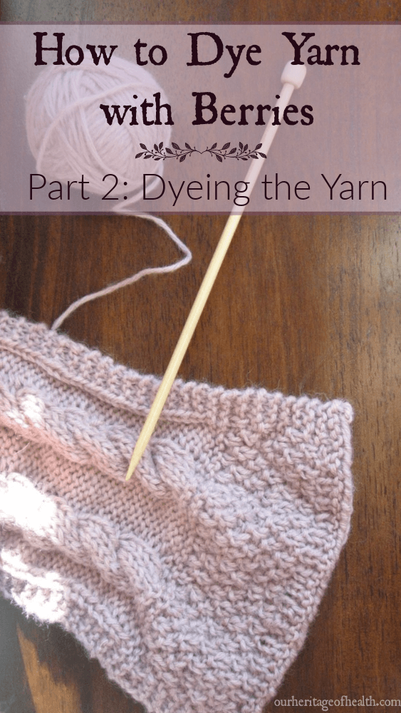 Ball of pale lavender yarn with knitting needle and end of knitted scarf