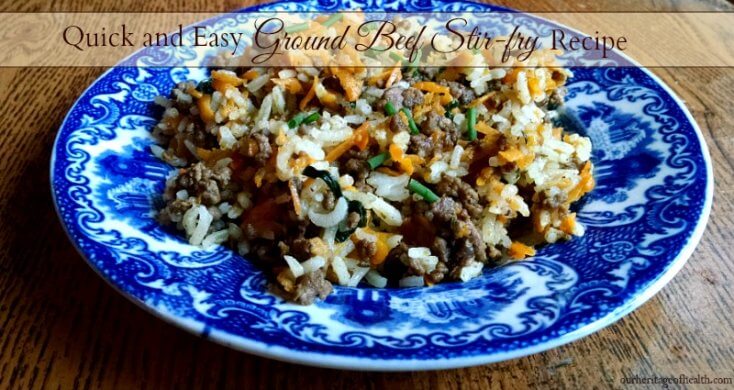 Ground beef stir fry on blue plate on table